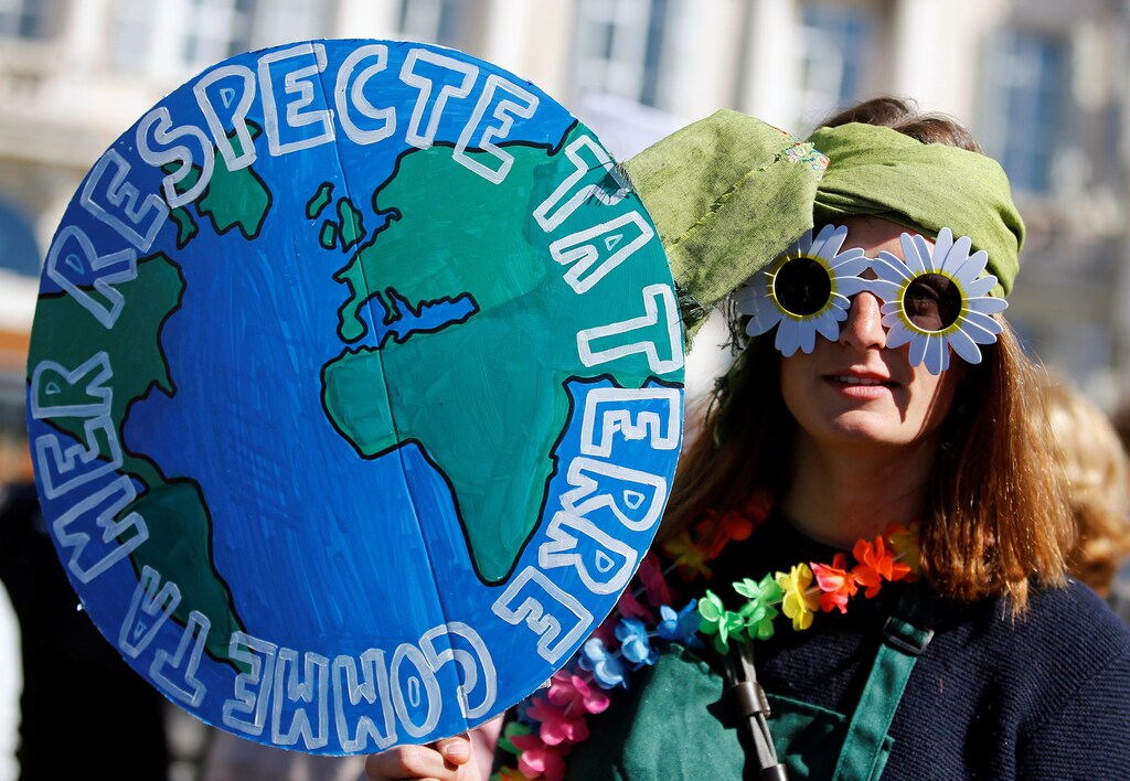 People attend a demonstration asking for urgent measures to combat climate change, in Marseille, France, March 16, 2019. The placard reads "Respect your planet like your sea". REUTERS/Jean-Paul Pelissier - RC1A2A71F630