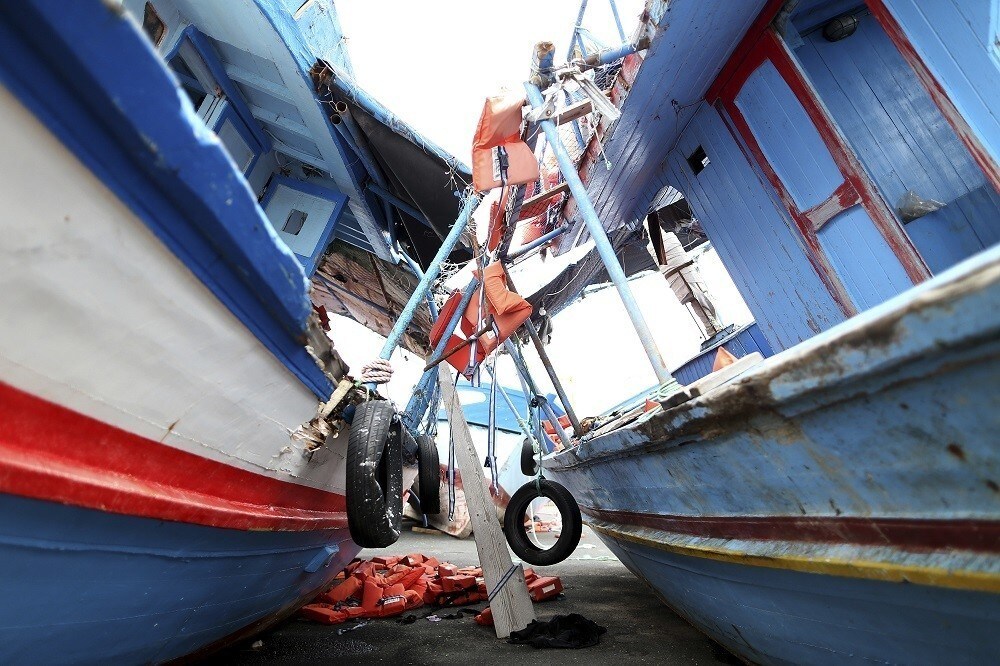 Life jackets used by migrants are seen left on two flotsams at the Sicilian harbor of Pozzallo, February 16, 2015. Better weather since last week has encouraged migrants to make the perilous journey from North Africa, where a breakdown of order in Libya has made it almost impossible to police the traffickers who pack people onto rickety boats. REUTERS Alessandro Bianchi (ITALY - Tags: SOCIETY IMMIGRATION POLITICS) - RTR4PST2