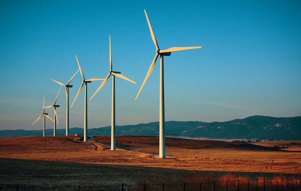 Wind turbines along a road.