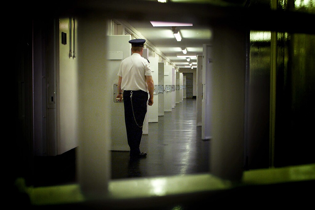 Northern Ireland's notorious Maze prison stands vacant, September 30,2000, after the last remaining guerrilla prisioners were transfered to other jails as part of a peace pact aimed at ending 30 years of political and religious strife. A prison guard is seen in this file photo taken July 25, 2000 as he patrols a corridor in H-Block 7 that once housed Irish Republican inmates.PM/PS/FMS - RP2DRIAOHGAB