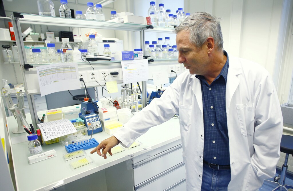 Martin Bachmann, Head of Department of Immunology of the Inselspital Universitaetsspital Bern university hospital, who researches a vaccine against the coronavirus disease (COVID-19), points on test samples after an interview with Reuters in Bern, Switzerland April 22, 2020.