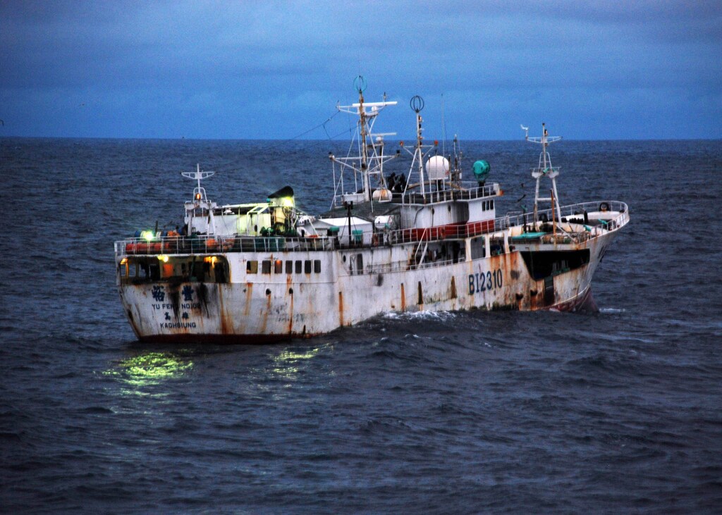Yu Feng, a Taiwanese-flagged fishing vessel suspected of illegal fishing activity, moves through the water before being boarded by crewmembers from U.S. Coast Guard Cutter Legare and representatives from Sierra Leone's Armed Forces Maritime Wing, Fisheries ministry and Office of National Security, Aug. 17 2009. Legare, homeported in Portsmouth, Va., is currently on a three-month deployment as part of Africa Partnership Station. APS is an international maritime safety and security initiative led by Commander, U.S. Naval Forces Europe-Africa/Commander, U.S. 6th Fleet.