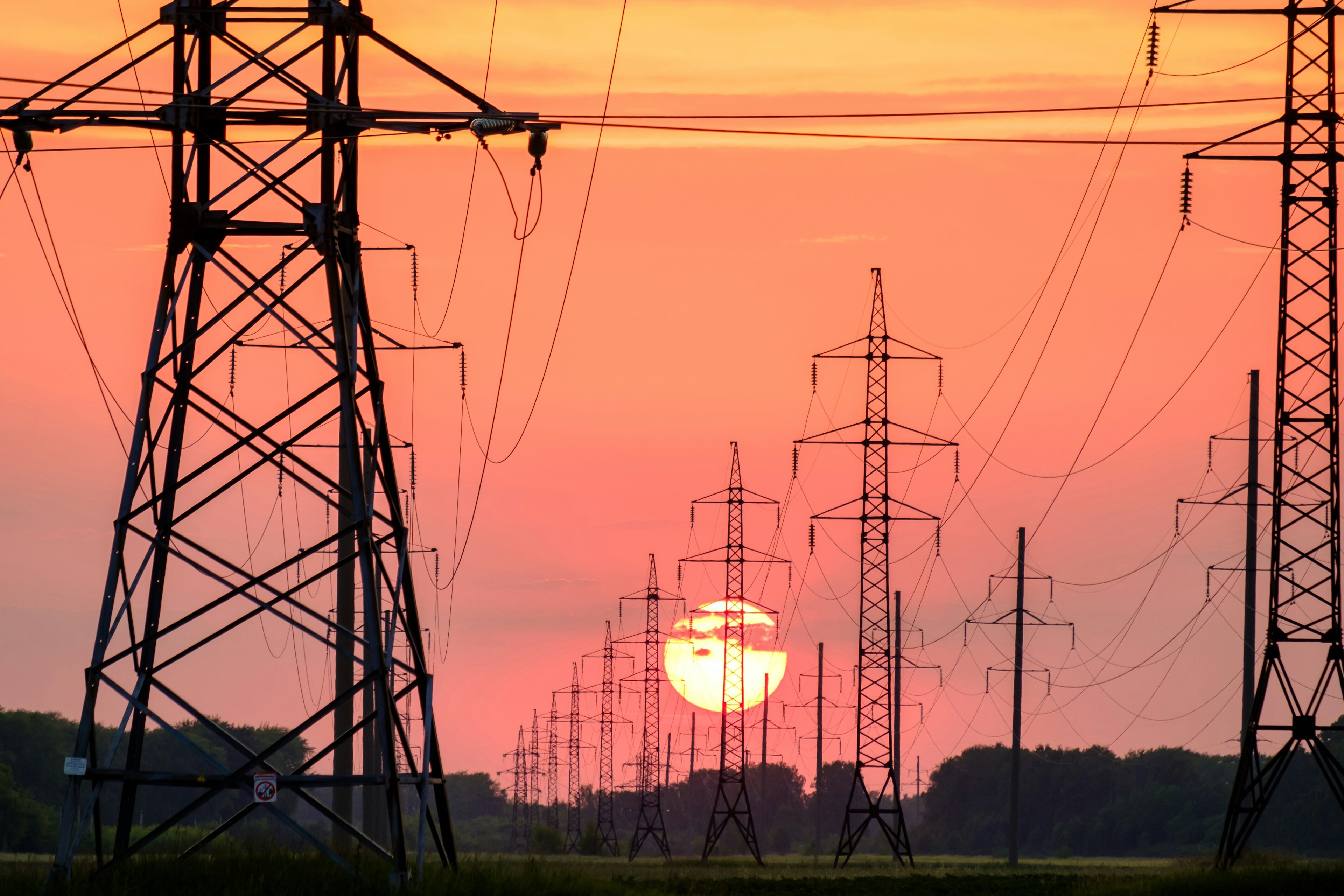 Pylons infront of a sunset. 