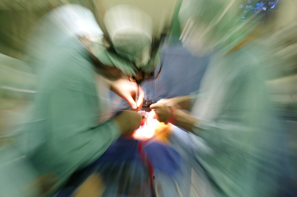 A zoomed picture shows two surgeons performing an operation to implant anartificial heart valve in the operating room of a Berlin hospital August 15,2003. Germany's generous health care system has come under attack, for beingtoo costly and inefficient with Europe's largest economy spending more onhealth per capita than any other nation apart from the United States andSwitzerland. NO RIGHTS CLEARANCES OR PERMISSIONS ARE REQUIRED FOR THIS IMAGE REUTERS/Fabrizio BenschFAB - RP4DRIFRTDAA