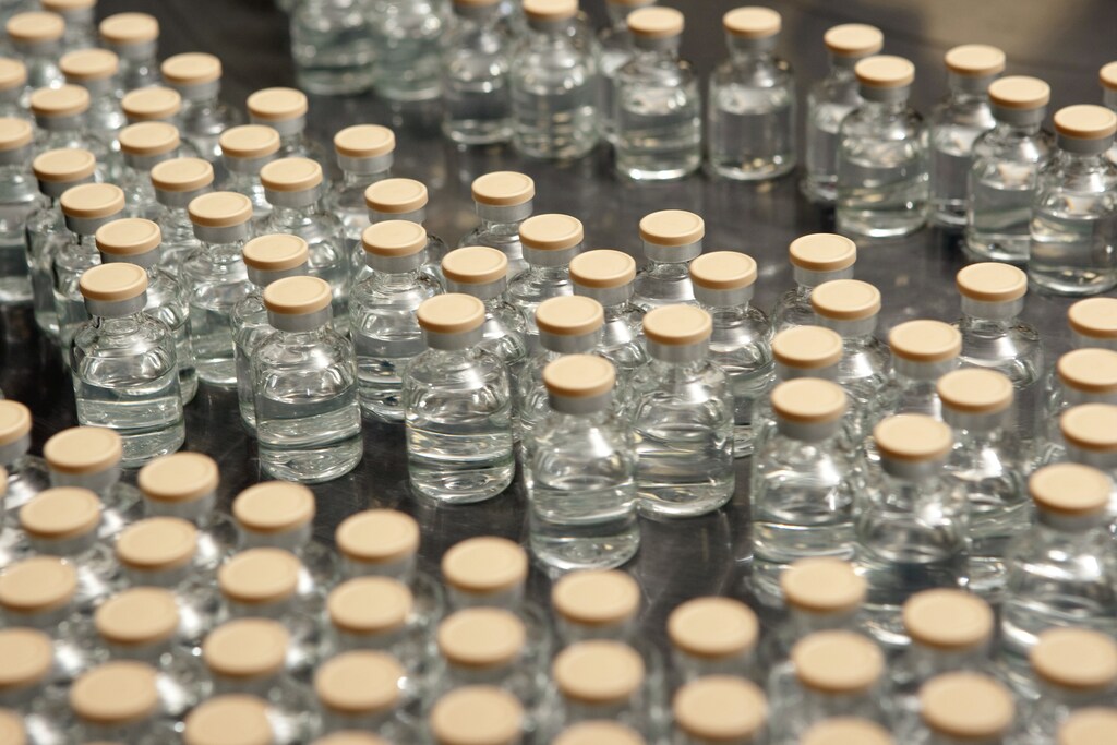 Vials of Influenza A(H1N1) monovalent vaccine are pictured on the labelling collection table at Sanofi Pasteur plant in Swiftwater, Pennsylvania, in this recent photograph released to Reuters on September 29, 2009. The chief executive officer of Sanofi-Aventis said on Tuesday his company has begun U.S. shipments of its H1N1 swine flu vaccine ahead of schedule. Swine flu was declared a pandemic in June and is spreading widely in most of the United States. At least 46 U.S. children under 18 have died from the flu strain since April, when it was first detected in the United States. REUTERS/Sanofi-Aventis/Handout (UNITED STATES HEALTH SCI TECH) FOR EDITORIAL USE ONLY. NOT FOR SALE FOR MARKETING OR ADVERTISING CAMPAIGNS - GM1E59U0BUT01