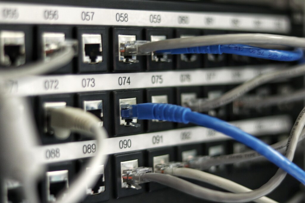 Image shows wires protruding from a data centre illustrating how energy intensive they are and why they should become part of the circular economy. illustrating how energy intensive they are and showing why hejn