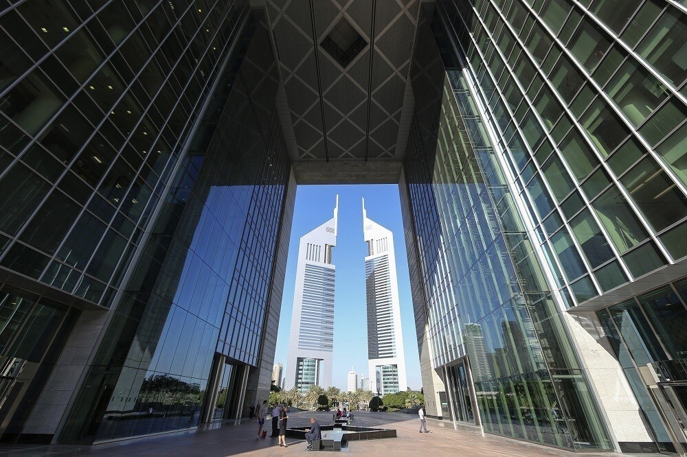 People are pictured at the Dubai International Financial Centre November 10, 2013. Dubai, at the heart of the wealthy Gulf, announced a push into Islamic finance this year. It has an entrepreneurial culture which has already made it the Middle East's top conventional banking centre, and big state-run firms which can be expected to support the government's strategy. Picture taken November 10, 2013. To match Analysis ISLAMIC-FINANCE/COMPETITION REUTERS/Omr Mohamed (UNITED ARAB EMIRATES - Tags: BUSINESS) - RTX15AGR