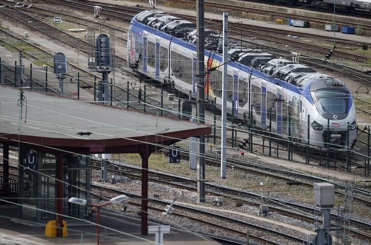 A new Regiolis regional train made by power and train-making firm Alstom, is seen next to a platform at Strasbourg's railway station, May, 21, 2014. France's national rail company SNCF said on Tuesday it had ordered 2,000 trains for an expanded regional network that are too wide for many station platforms, entailing costly repairs. REUTERS/Vincent Kessler (FRANCE - Tags: POLITICS TRANSPORT BUSINESS)