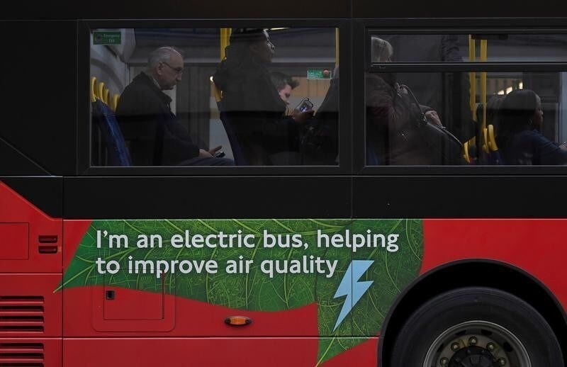 Passengers sit on an electric public bus on the day that Mayor of London Sadiq Khan outlined plans to place a levy on the most polluting vehicles in London, Britain, April 4, 2017. REUTERS/Toby Melville - RC1BBDE059E0
