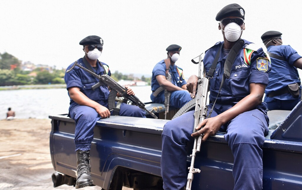 Congolese policemen wear masks as they ride on their patrol pick-up truck amid the coronavirus disease (COVID-19) outbreak in Goma, eastern Democratic Republic of Congo, March 19, 2020. REUTERS/Olivia Acland - RC25NF9MLW2X
