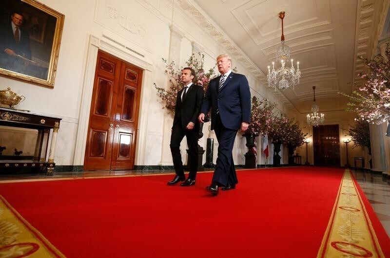 U.S. President Donald Trump (R) and French President Emmanuel Macron arrive for their joint news conference at the White House in Washington, U.S., April 24, 2018. REUTERS/Kevin Lamarque - HP1EE4O1EMZAT