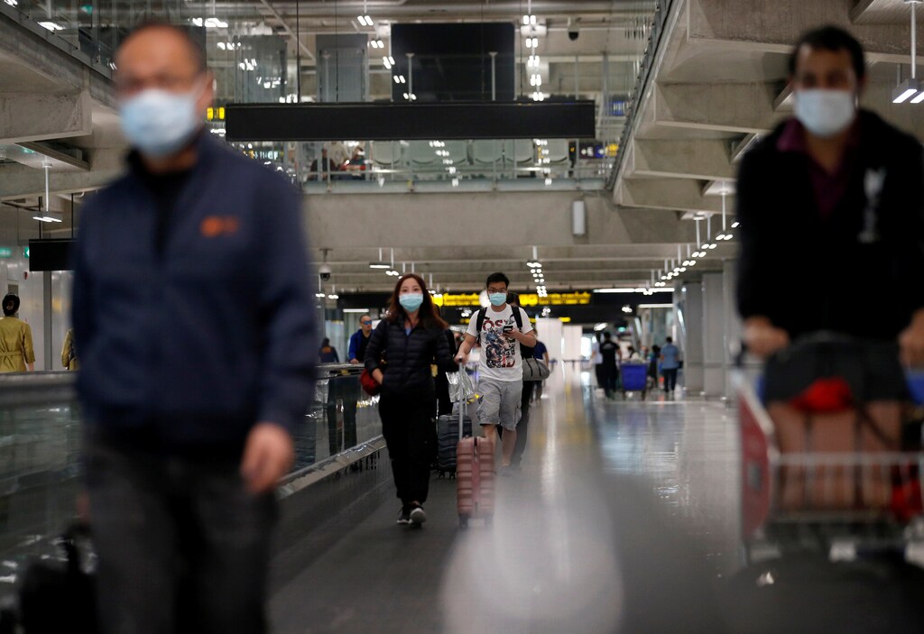 Passengers wear protective masks due to the coronavirus outbreak as they arrive at Suvarnabhumi Airport in Bangkok, Thailand Coronavirus china virus health healthcare who world health organization disease deaths pandemic epidemic worries concerns Health virus contagious contagion viruses diseases disease lab laboratory doctor health dr nurse medical medicine drugs vaccines vaccinations inoculations technology testing test medicinal biotechnology biotech biology chemistry physics microscope research influenza flu cold common cold bug risk symptomes respiratory china iran italy europe asia america south america north washing hands wash hands coughs sneezes spread spreading precaution precautions health warning covid 19 cov SARS 2019ncov wuhan sarscow wuhanpneumonia pneumonia outbreak patients unhealthy fatality mortality elderly old elder age serious death deathly deadly