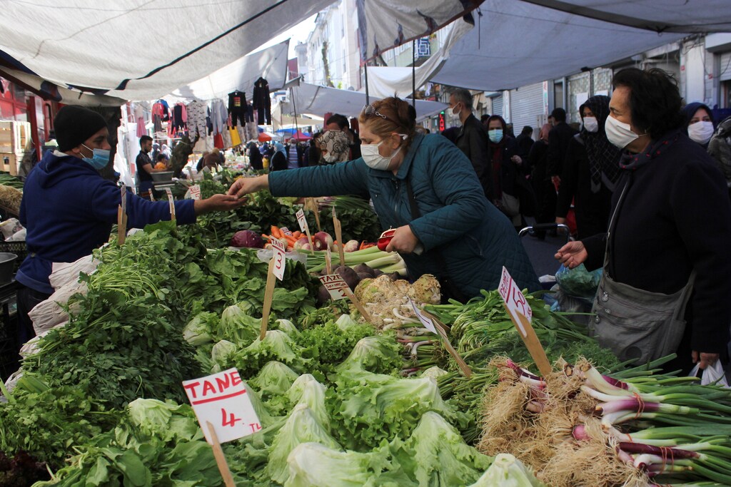 People wearing protective face masks shop at a fresh market, amid the coronavirus disease (COVID-19) pandemic, in Istanbul, Turkey April 26, 2021