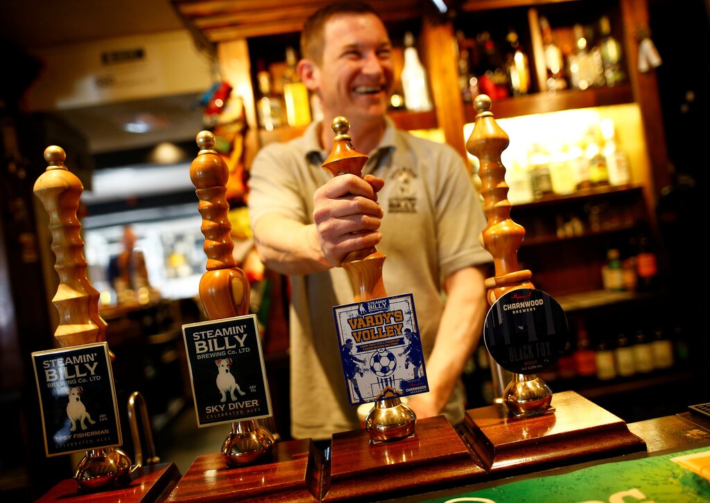 A barman pulls a pint of Vardy's Volley beer at the Dog and Gun pub in Syston near Leicester, Britain.