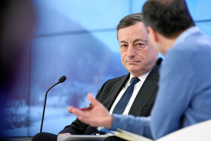 Mario Draghi (L), President, European Central Bank, Frankfurt is interviewed by Lionel Barber (R), Editor, Financial Times, United Kingdom, captured at the Annual Meeting 2016 of the World Economic Forum in Davos, Switzerland, January 22, 2016.