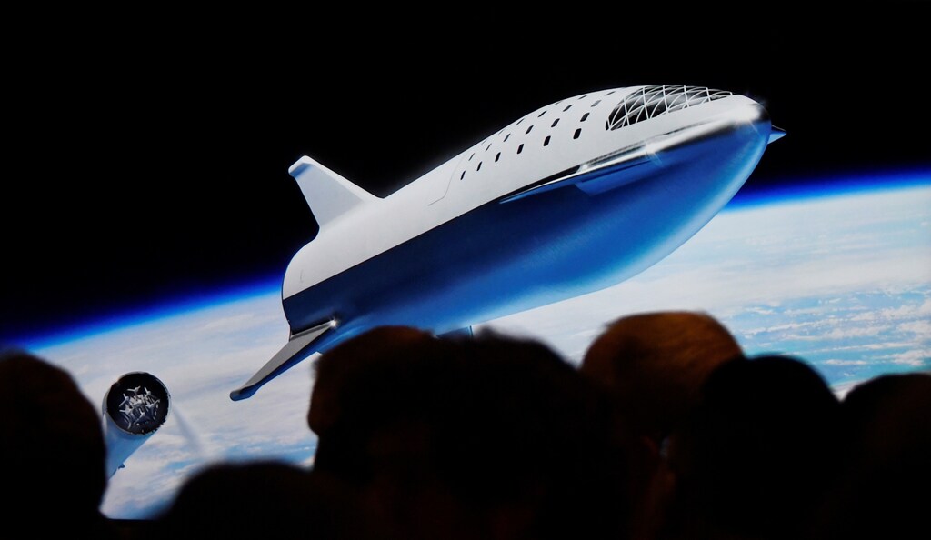 SpaceX CEO Elon Musk shows how the new BFR works during a press conference announcing the worlds first private passenger scheduled to fly around the Moon aboard SpaceXs BFR launch vehicle, at the company's headquarters in Hawthorne, California, U.S. September 17, 2018. REUTERS/Gene Blevins - RC19D89B4790