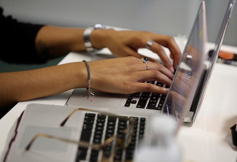 Student Jenna Diop, aged 20, works in her web development class as part of professional training at the Simplon.co school specialized in digital sector in Montreuil, near Paris, France, June 14, 2018.
