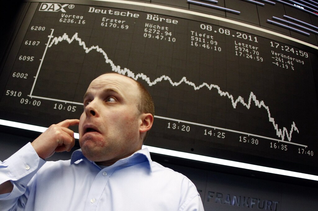 a stock trader reacts to a fall in the markets