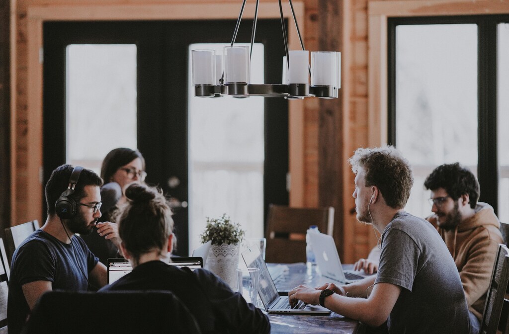 These people are working on a task together - however, depending on the nature of the assignment, teamwork may not always be the best way to get things done