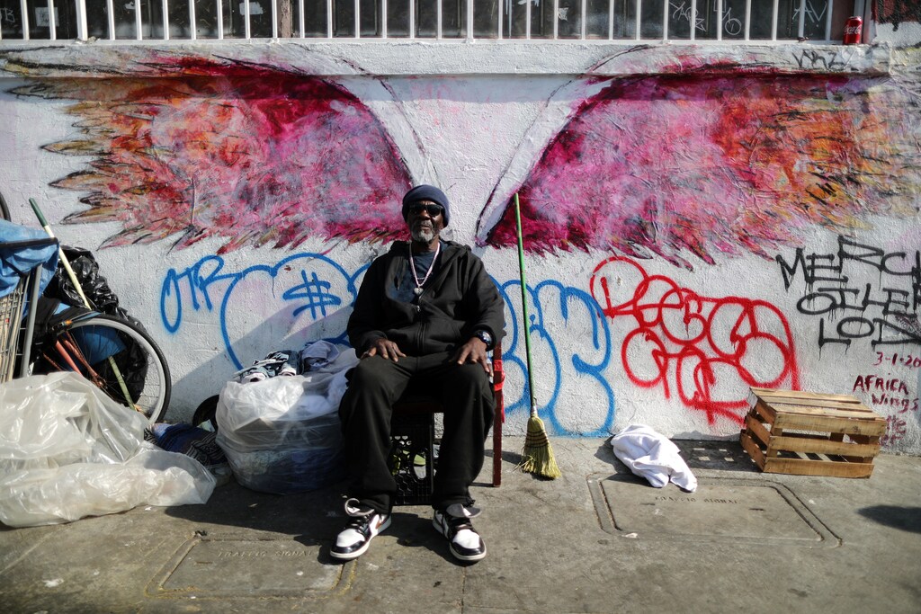 Willie Bassie, 58, sits next to his tent on Skid Row in Los Angeles, California, October 14, 2019. REUTERS/Lucy Nicholson