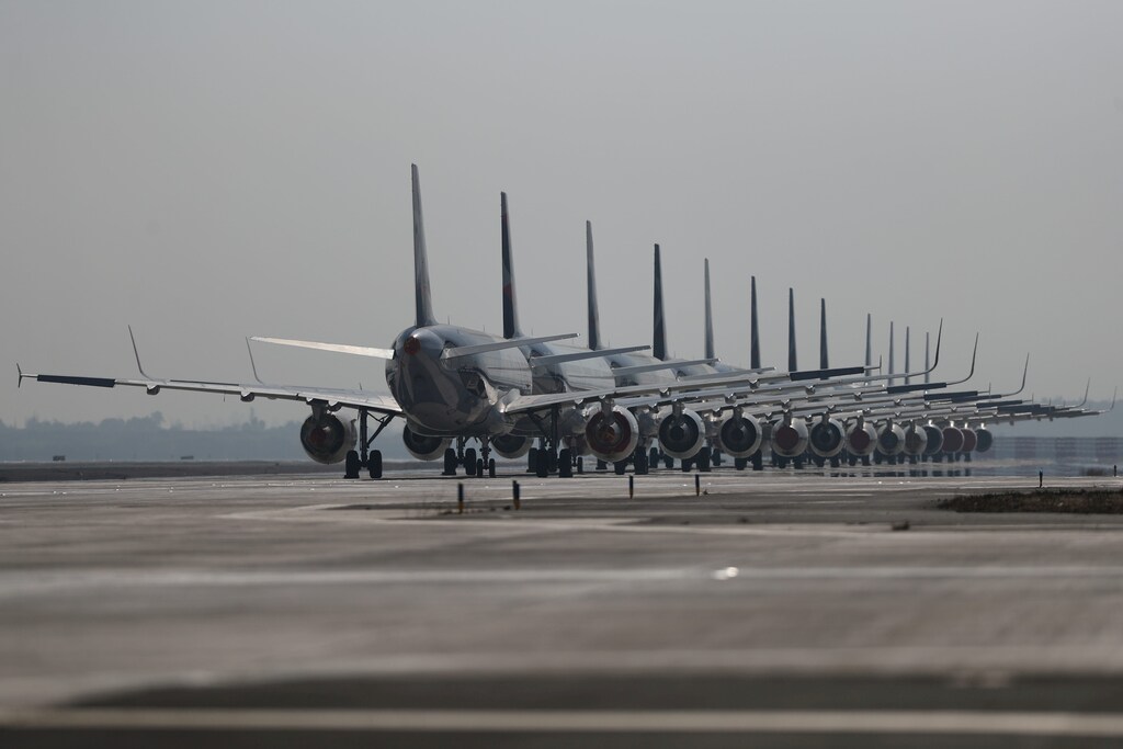 Passenger planes parked on a runway are seen during a general quarantine amid the spread of the coronavirus disease (COVID-19), at the Arturo Merino Benitez International Airport, in Santiago, Chile May 26, 2020. REUTERS/Ivan Alvarado - RC2JWG9PUA06