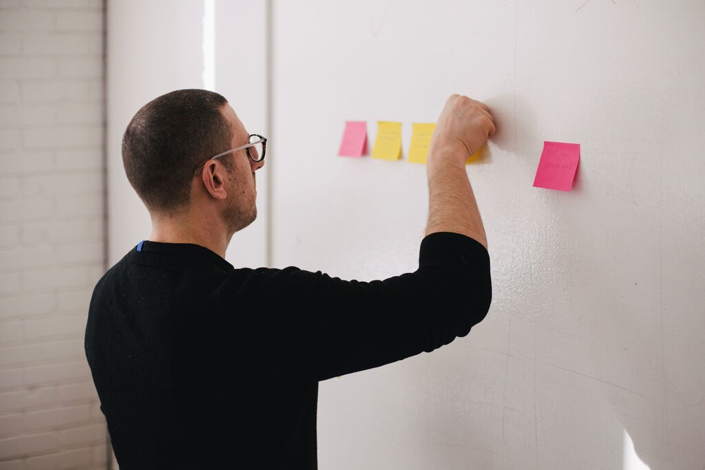 man sticky notes ideas workshop skills hr human resources company boardroom thinking thinker