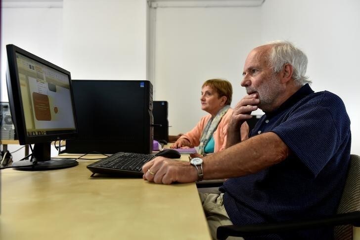 Seniors learn how to use computers in a youth center in Brussels, Belgium June 27, 2017. REUTERS/Eric Vidal