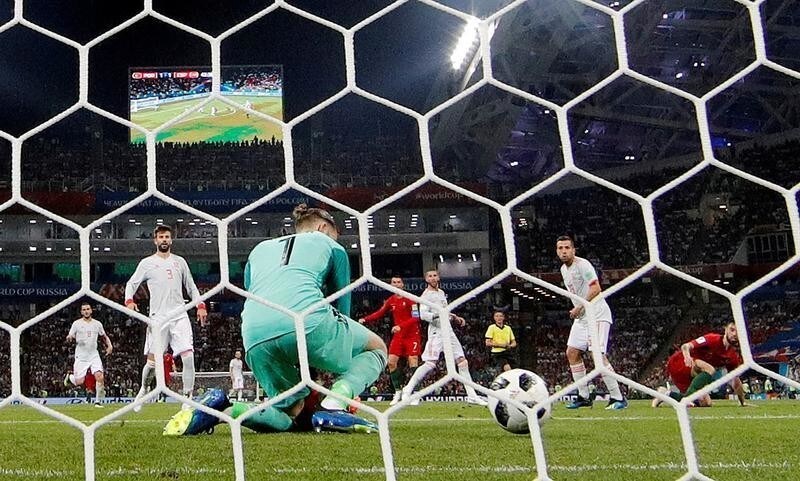 Soccer Football - World Cup - Group B - Portugal vs Spain - Fisht Stadium, Sochi, Russia - June 15, 2018 Portugal's Cristiano Ronaldo scores their second goal past Spain's David De Gea REUTERS/Murad Sezer TPX IMAGES OF THE DAY - RC15D8D19080