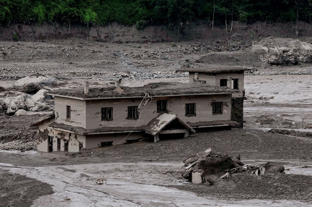 Mud covers a property following a flash flood at Trishuli in Nuwakot district, Nepal, 26 August, 2026.