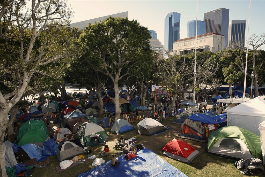 Occupiers continue to camp prior to an anticipated police raid to shut down the Occupy Los Angeles encampment outside City Hall in Los Angeles, California November 26, 2011. Hundreds of anti-Wall Street protesters will be evicted on Monday from their encampment in front of Los Angeles City Hall, city officials said on Friday. The nearly two-month-old encampment is among the oldest and largest on the West Coast aligned with the Occupy Wall Street demonstrations protesting economic inequality in the country and the excesses of the U.S. financial system. REUTERS/David McNew (UNITED STATES - Tags: POLITICS CIVIL UNREST BUSINESS) - GM1E7BR0MDN01