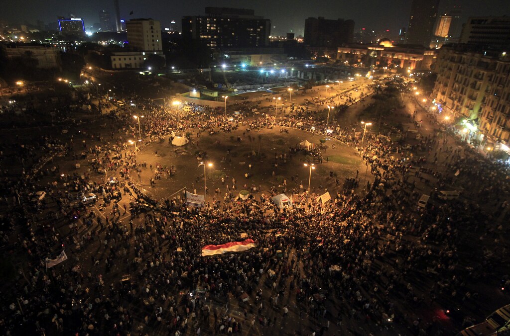 Protesters gather at Tahrir square in Cairo November 23, 2012. Angry youths hurled rocks at security forces and burned a police truck as thousands gathered in central Cairo to protest at Egyptian President Mohamed Mursi's decision to grab sweeping new powers. Police fired tear gas near Tahrir Square, heart of the 2011 uprising that toppled Hosni Mubarak at the height of the Arab Spring. Thousands demanded that Mursi should quit and accused him of launching a "coup". REUTERS/Mohamed Abd El Ghany (EGYPT - Tags: POLITICS CIVIL UNREST) - RTR3AT0A