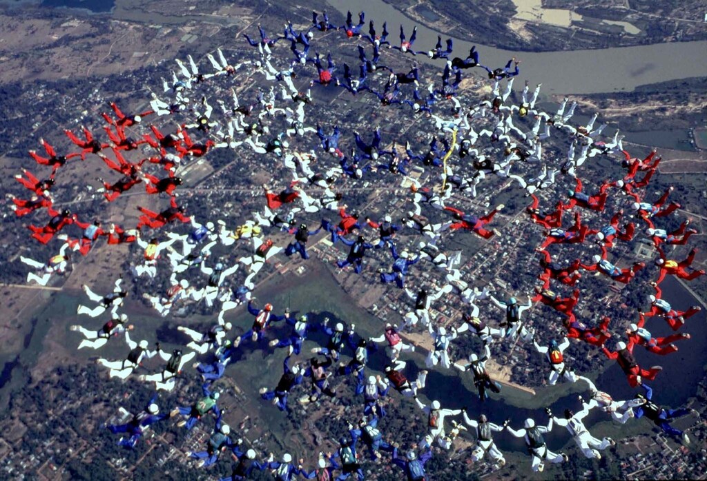 Skydivers from the "World Team '99" attempt a world record for the number of people in a formation dive in Ubon Ratchathani, about 700 kilometres northwest of Bangkok December 14. Up to 324 divers are expected to take part in the record-setting event, part of celebrations marking the 72nd birthday of Thailand's King Bhumibol Adulyadej this year.JIR/TAN - RTR13GNQ
