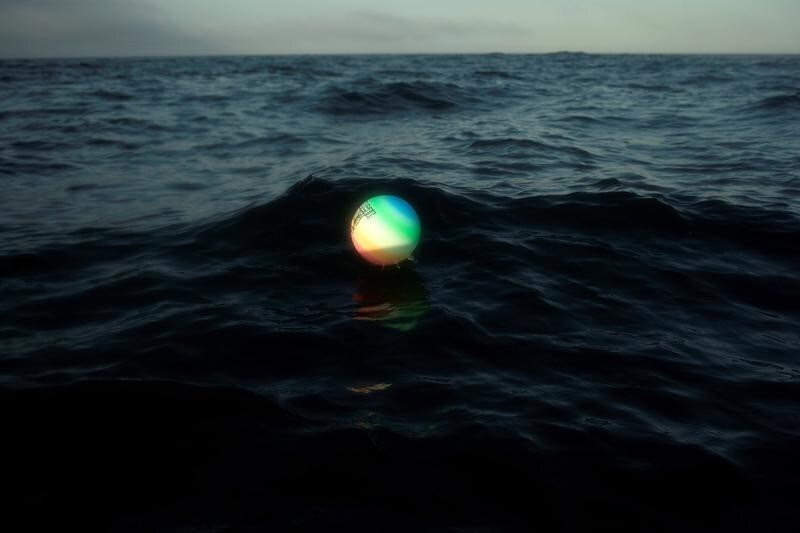A plastic ball for beach volleyball games is seen floating in the Strait of Gibraltar, about 6.8 miles (11 km) of distance from the nearest coast, near Barbate, southern Spain, July 31, 2018. Picture taken July 31, 2018. REUTERS/Jon Nazca TPX IMAGES OF THE DAY - RC1D34842A40