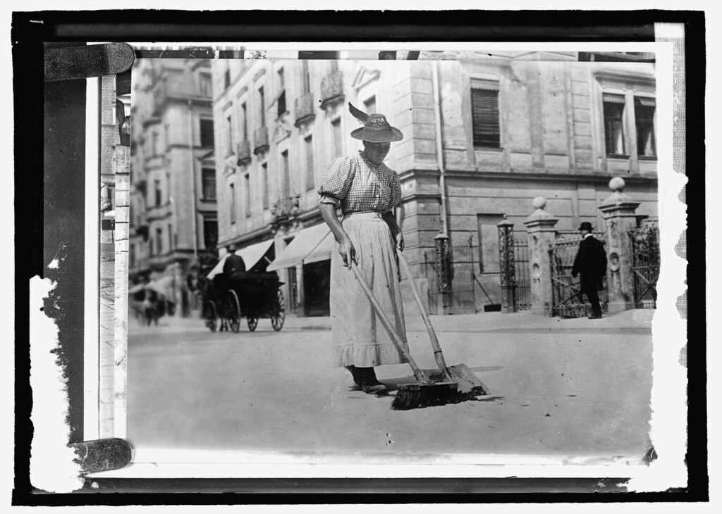 A woman street worker sweeps a street in Germany, circa 1909-1920, in this Library of Congress handout photo. For women 100 years ago, opportunities to work beyond the home and take part in political life were very limited. As the 20th century progressed, hard-won progress included gradually improved voting rights, while the upheaval of war pushed doors ajar as women worked as part of the war effort. U.S. Library of Congress archive photos show women's workplaces ranging from a flour mill in England to a coal mine in Belgium or Lincoln Motor Co.'s welding department in Detroit. International Women's Day is celebrated on March 8. REUTERS/National Photo Company Collection/Library of Congress/Handout via Reuters SEARCH "THE WIDER IMAGE" FOR ALL STORIES ATTENTION EDITORS - THIS PICTURE WAS PROVIDED BY A THIRD PARTY. REUTERS IS UNABLE TO INDEPENDENTLY VERIFY THE AUTHENTICITY, CONTENT, LOCATION OR DATE OF THIS IMAGE. THIS PICTURE IS DISTRIBUTED EXACTLY AS RECEIVED BY REUTERS, AS A SERVICE TO CLIENTS. FOR EDITORIAL USE ONLY. NOT FOR SALE FOR MARKETING OR ADVERTISING CAMPAIGNS. - GF10000329666