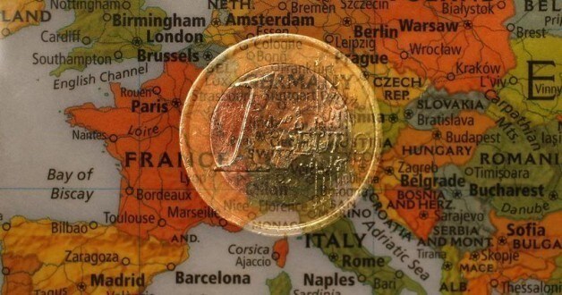A picture illustration taken with the multiple exposure function of the camera shows a one Euro coin and a map of Europe, January 9, 2013. The cost of living in the euro zone rose more than expected in December but remained benign enough to allow a possible cut in interest rates in 2013 to support the bloc's feeble economy. The European Central Bank's Governing Council meets on Jan. 10, with policymakers appearing unwilling to countenance a rate cut so early in the year. REUTERS/Kai Pfaffenbach