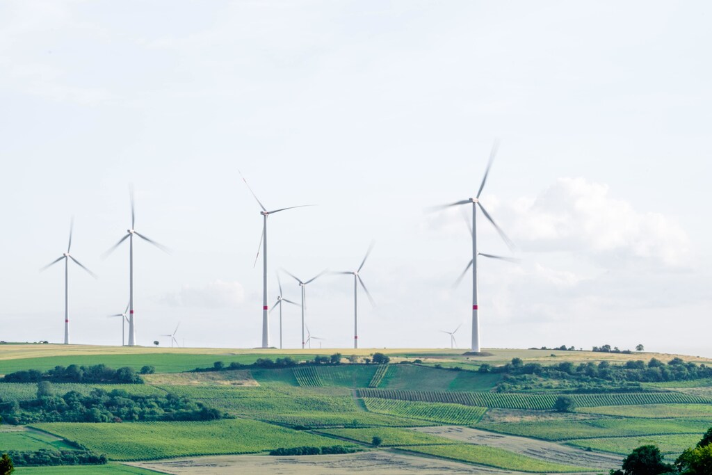 Pictured here: Wind Turbines in an open field, It will take all of these game changers and more to make a cleaner, fairer world.