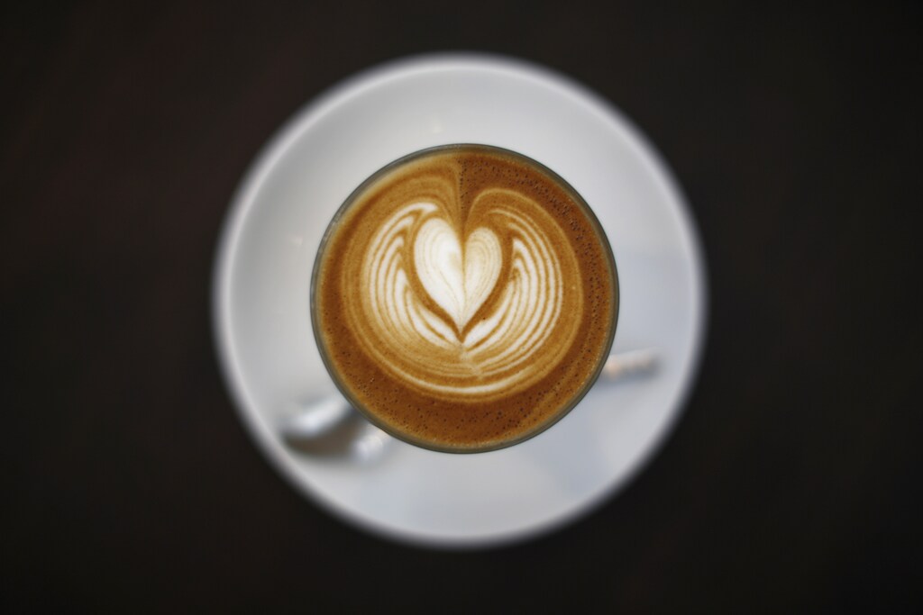 A cup of latte is pictured at a cafe in Sydney May 12, 2014. The Australian Bureau of Meteorology (BOM) has said the chances this year of the much-feared El Nino phenomenon that can wreak havoc on global crops stands at 70 percent. El Nino, a warming of sea-surface temperatures in the Pacific, can trigger both floods and drought in different parts of the globe and erratic weather could affect the development of coffee cherries and cocoa pods around the world, pushing up prices. REUTERS/Jason Reed (AUSTRALIA - Tags: ENVIRONMENT BUSINESS COMMODITIES AGRICULTURE) - RTR3OPM6