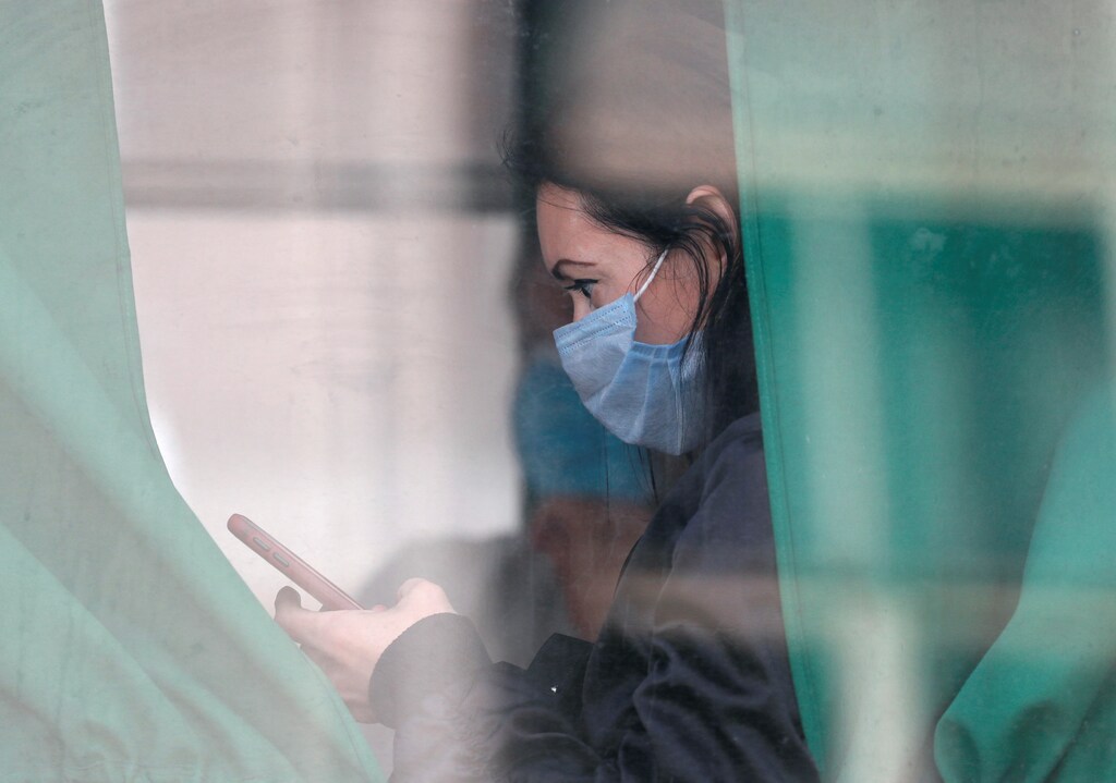 A passenger wearing a protective face mask is seen in a bus amid the coronavirus disease (COVID-19) in central Kyiv, Ukraine September 28, 2020. REUTERS/Gleb Garanich - RC2P7J9SOZ44