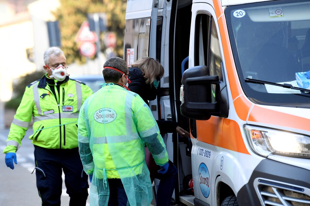 A woman is taken into an ambulance amid a coronavirus outbreak in northern Italy, in Casalpusterlengo, February 22, 2020. REUTERS/Flavio Lo Scalzo - RC2Q5F91FQW4