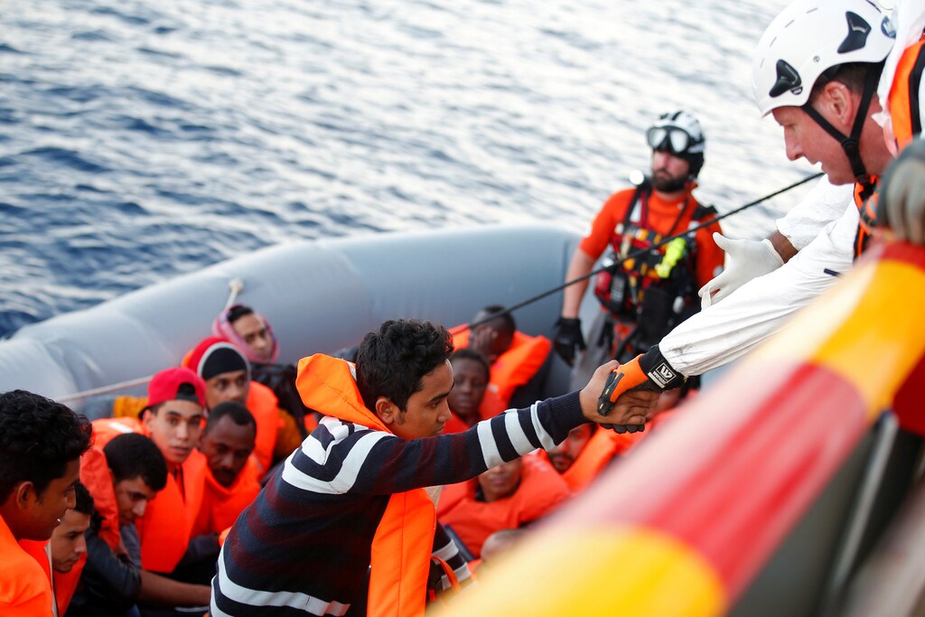 Migrants are seen during rescue operation in the Mediterranea Sea October 20, 2016. Yara Nardi/Italian Red Cross press office/Handout via Reuters ATTENTION EDITORS - THIS IMAGE WAS PROVIDED BY A THIRD PARTY. EDITORIAL USE ONLY. - RTX2PPMI