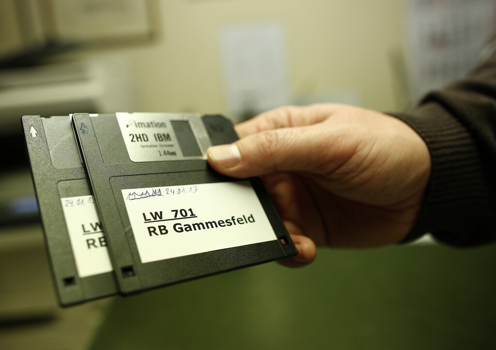 Peter Breiter, CEO of Raiffeisen Gammesfeld eG bank, displays the latest floppy disks at the bank in Gammesfeld, Baden-Wuerttemberg January 29, 2013. The Raiffeisen Gammesfeld eG cooperative bank is one of the country's smallest banks and is the only one to be run by just one member of staff. All banking duties are done by CEO Peter Breiter who records the daily business by hand, partly on paper. The bank is not connected to a database system, there are no automatic teller machines (ATMs) and its customer base consists only of residents of the town of Gammesfeld which has a population of around 510. Picture taken January 29, 2013. REUTERS/Lisi Niesner (GERMANY - Tags: BUSINESS SOCIETY)ATTENTION EDITORS: PICTURE 15 OF 26 FOR PACKAGE 'GERMANY'S ONE MAN BANK'. TO FIND ALL IMAGES SEARCH 'Raiffeisen' - GM1E92D17AM01
