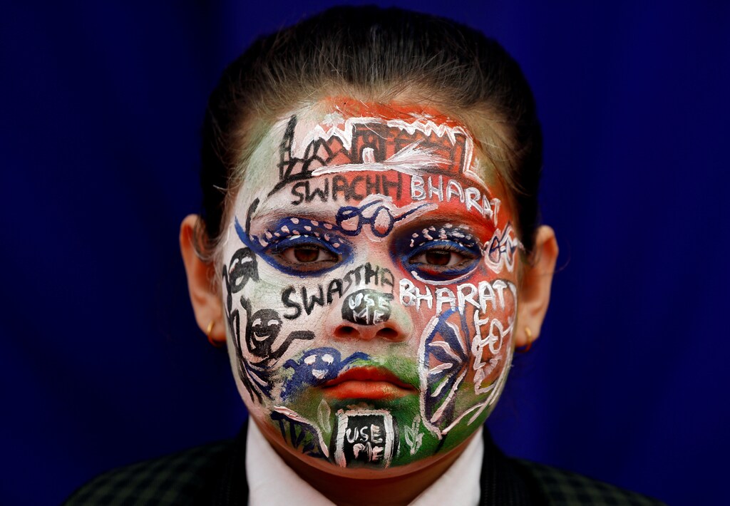 A school girl with painted face participates in an event to mark World Toilet Day in New Delhi, India, November 19, 2018.