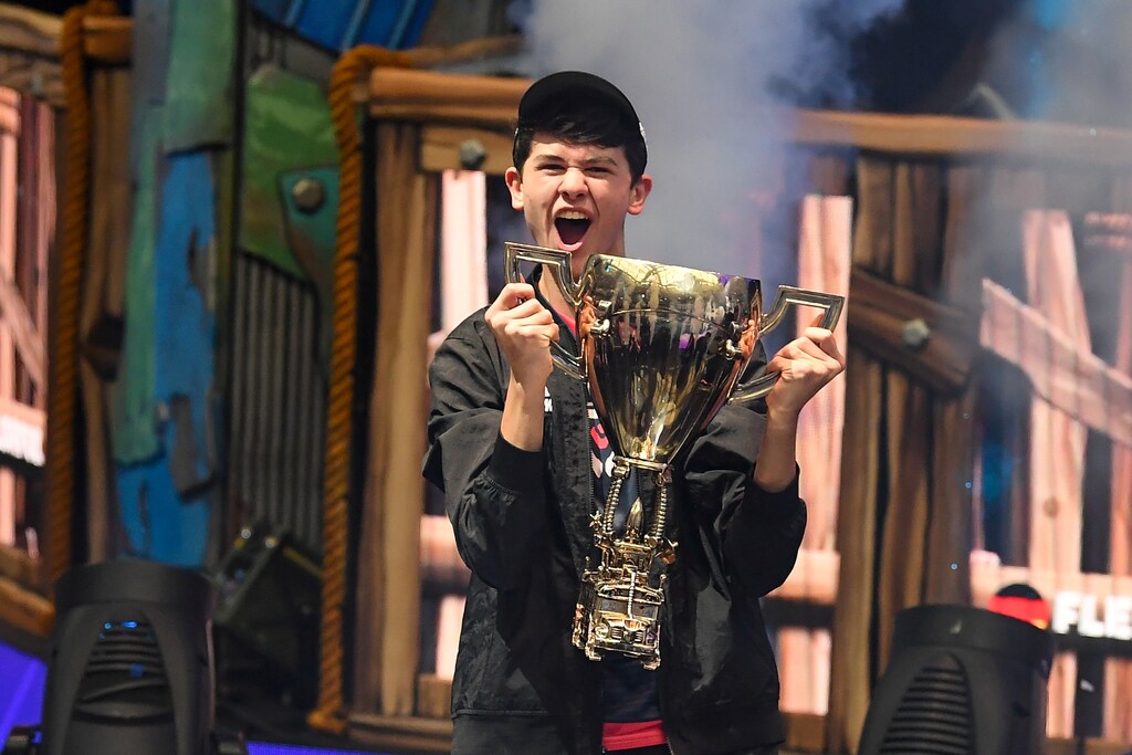 Jul 28, 2019; Flushing, NY, USA; Bugha celebrates his win as the first solo World Champion at the Fortnite World Cup Finals e-sports event at Arthur Ashe Stadium. Mandatory Credit: Dennis Schneidler-USA TODAY Sports TPX IMAGES OF THE DAY - RC14CA9AD2D0