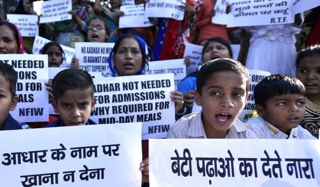 NEW DELHI, INDIA - MARCH 17: Children from government school protest at Shastri Bhawan against making Aadhar card mandatory for mid-day meal on March 17, 2017 in New Delhi, India. Considering the usefulness of Aadhaar in curbing leakages and bringing transparency in delivery system, the government had recently issued orders to use Aadhaar in several other welfare schemes funded from the Consolidated Fund of India. (Photo by Arun Sharma/Hindustan Times via Getty Images)