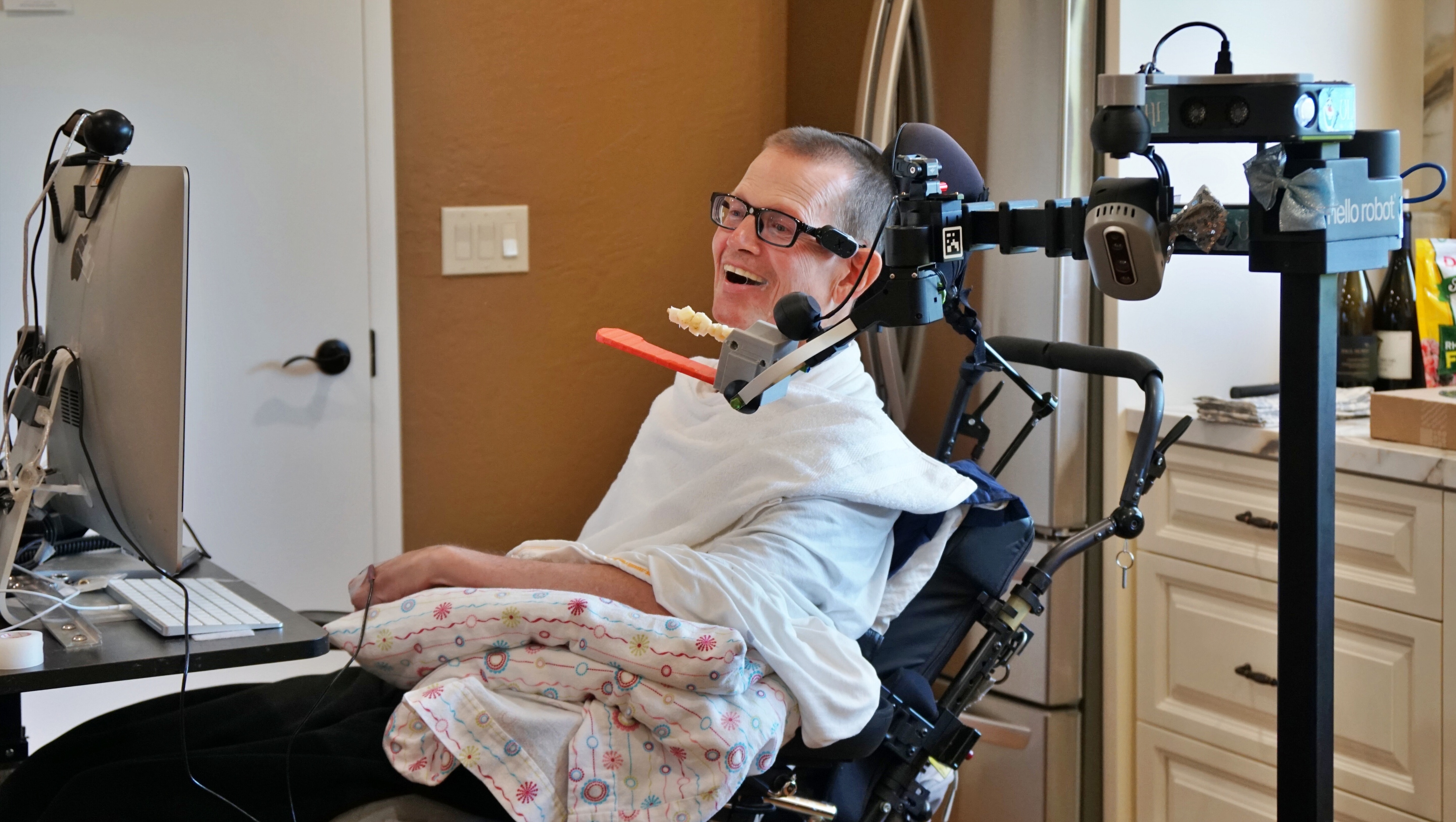 The Stretch assistive robot helps Henry Evans eat.