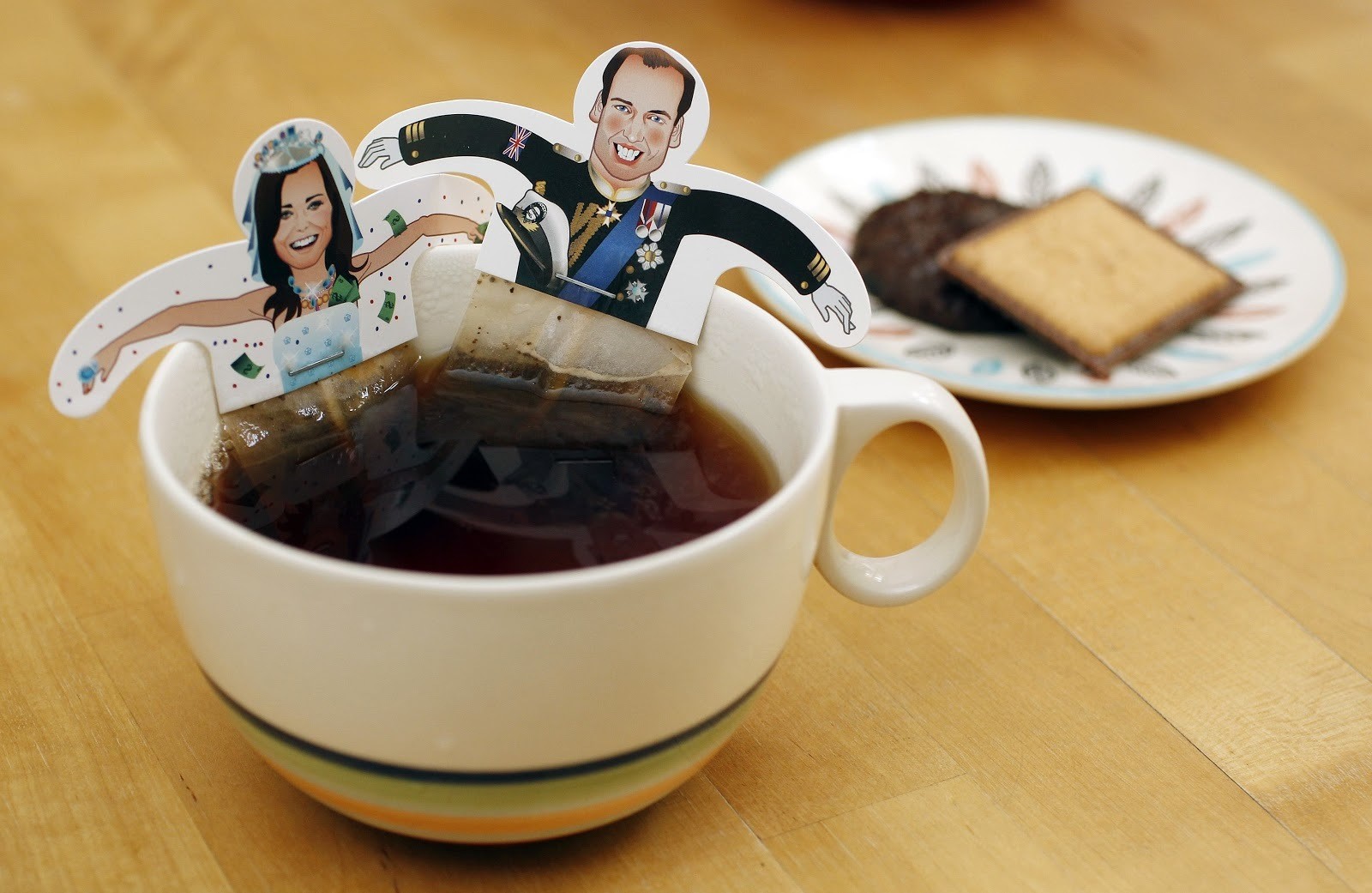 Souvenir teabags with depictions of Britain's Prince William and Kate Middleton are seen in London April 7, 2011. A British minister said on Wednesday that two billion people were expected to tune in to TV broadcasts to watch this month's royal wedding between Prince William and Kate Middleton on April 29.   REUTERS/Suzanne Plunkett (BRITAIN - Tags: ROYALS ENTERTAINMENT SOCIETY) - LM1E74718CS01