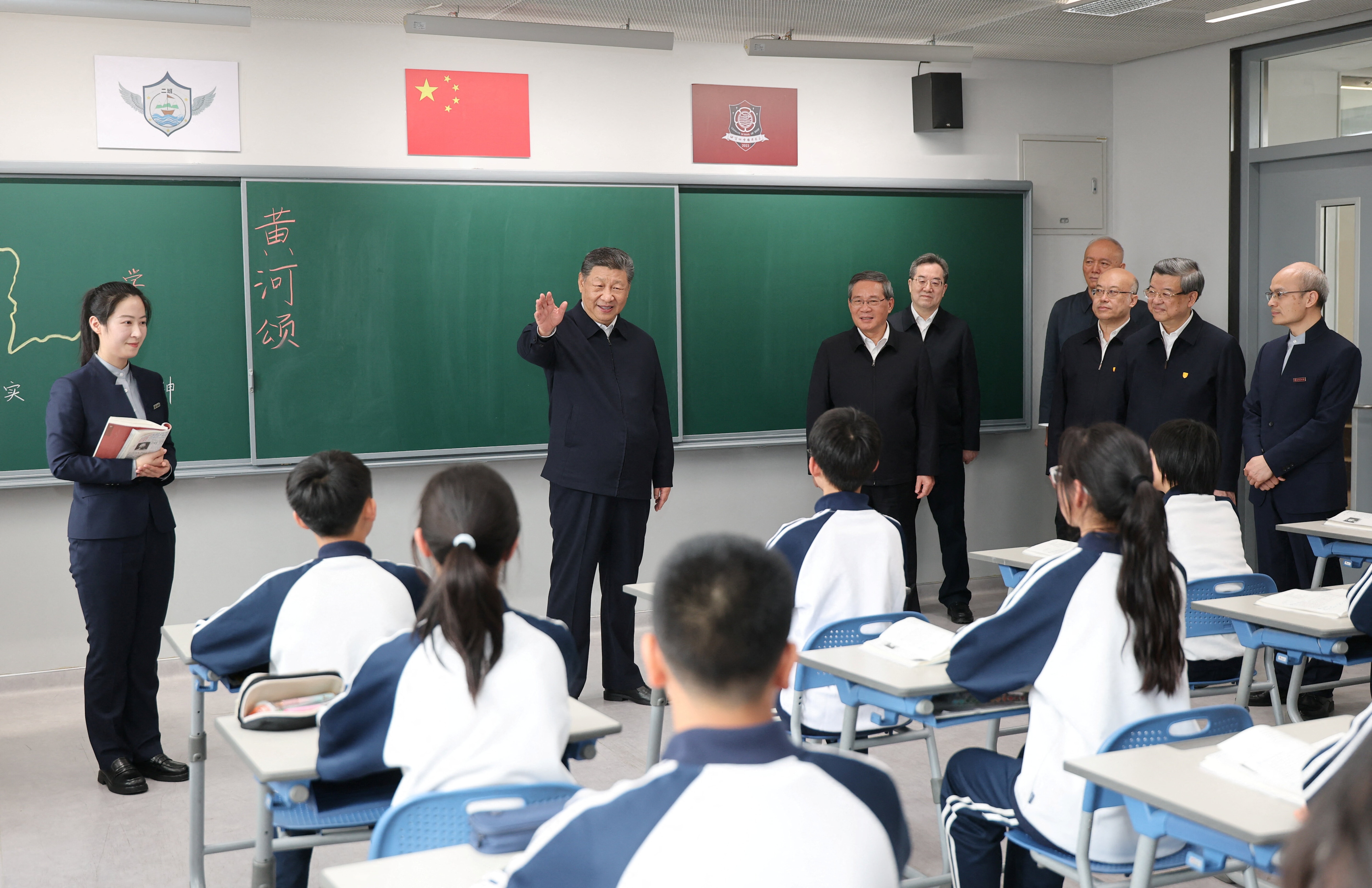 Chinese President Xi Jinping talks with students in a classroom at a high school, during an inspection tour of Xiongan New Area in Hebei province, China.