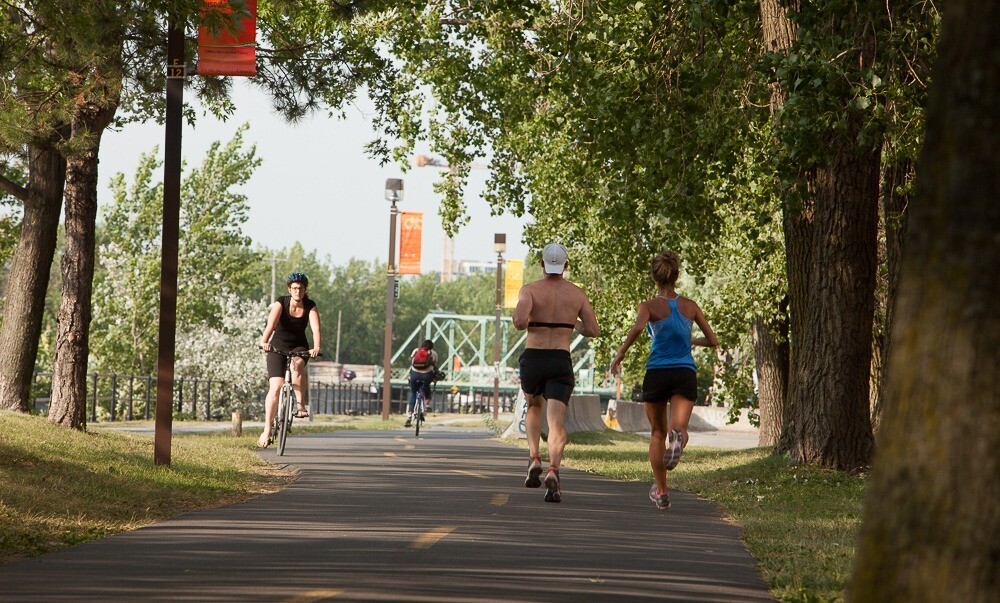 People exercise on Montréal’s revitalized Lachine Canal, now a hub for active mobility and community life