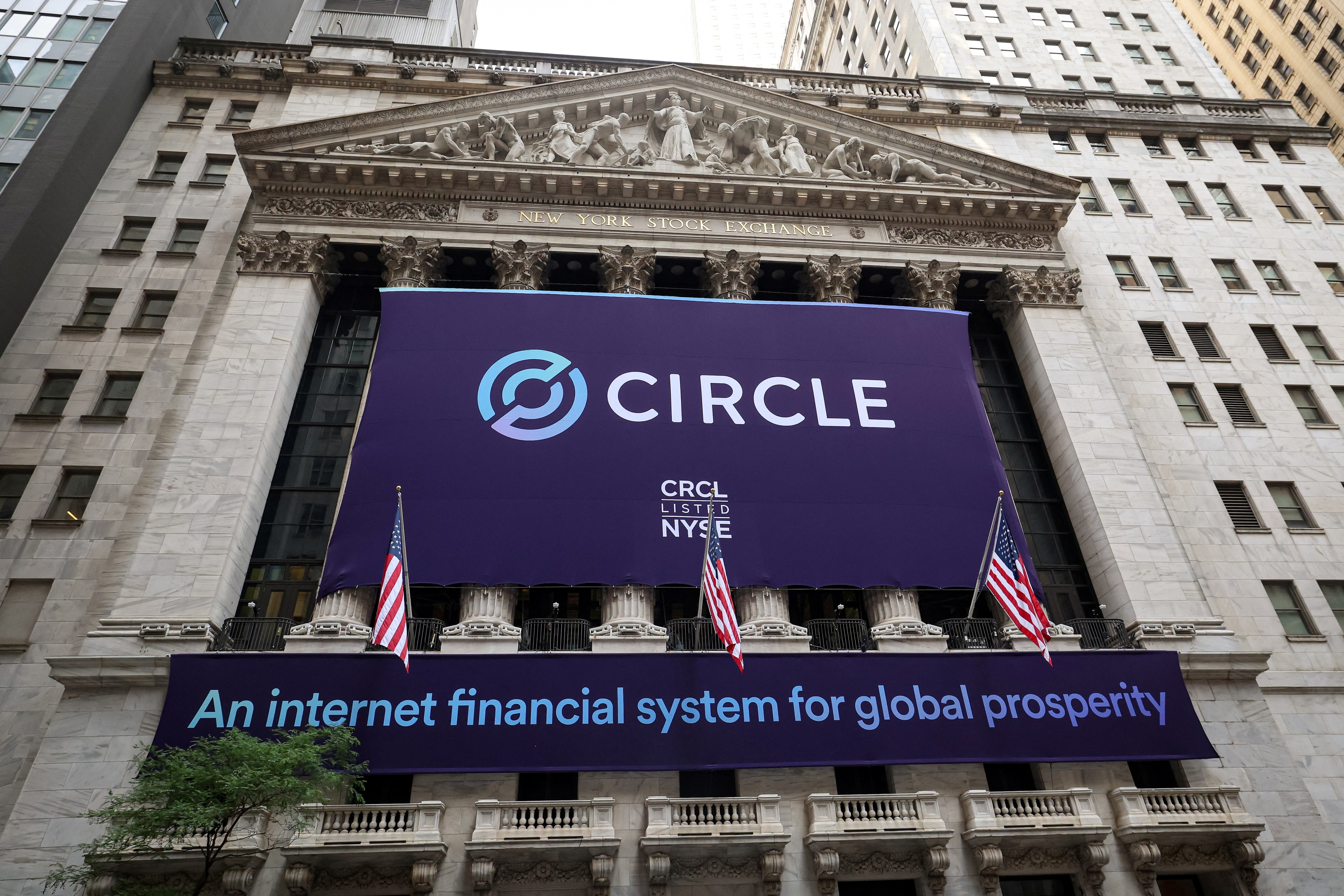 A banner for Circle Internet Group, the issuer of one of the world's biggest stablecoins, hangs on the front of the New York Stock Exchange (NYSE) to celebrate the company's IPO in New York City, U.S., June 5, 2025