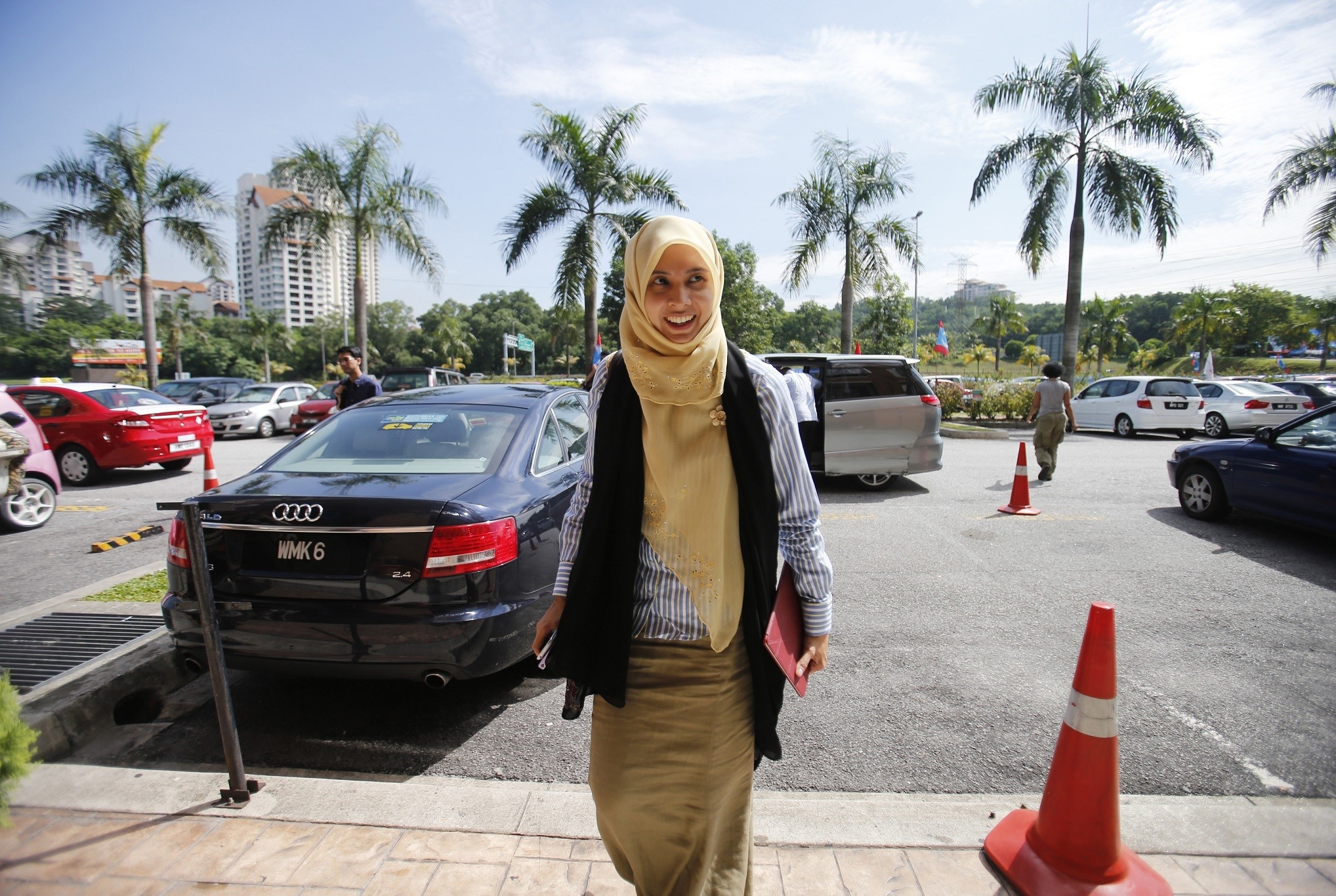 Nurul Izzah Anwar, a daughter of opposition leader Anwar Ibrahim, arrives at their party headquarters in Petaling Jaya outside Kuala Lumpur May 7, 2013. Anwar vowed on Tuesday to lead a                  